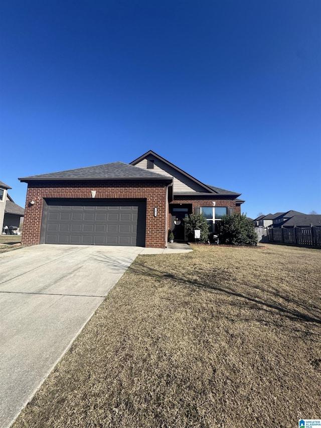 single story home with a garage and a front lawn