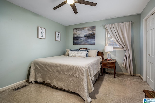 bedroom with carpet, ceiling fan, and a closet