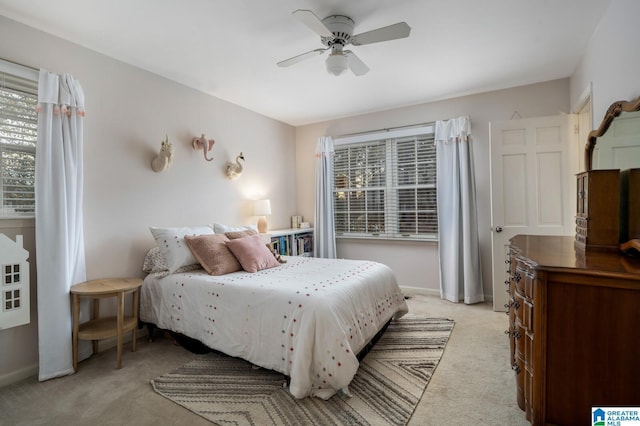 bedroom with light carpet and ceiling fan