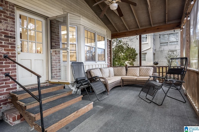 sunroom / solarium with ceiling fan and lofted ceiling with beams