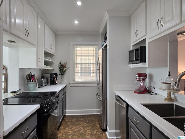 kitchen with white cabinets, crown molding, sink, and stainless steel appliances