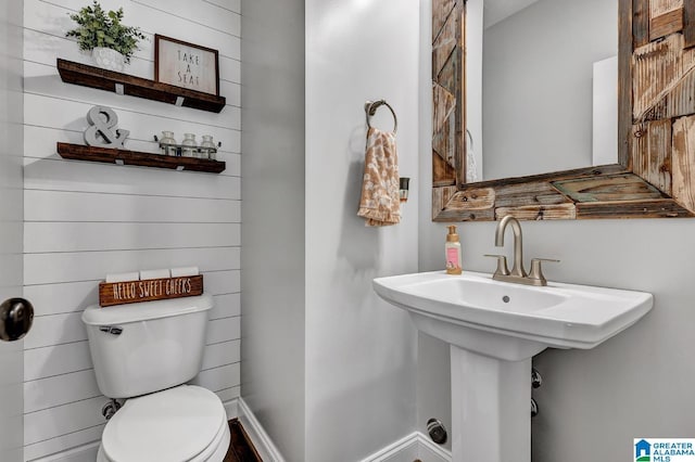 bathroom with sink and toilet