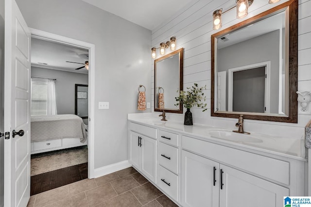 bathroom with tile patterned floors, ceiling fan, vanity, and ornamental molding