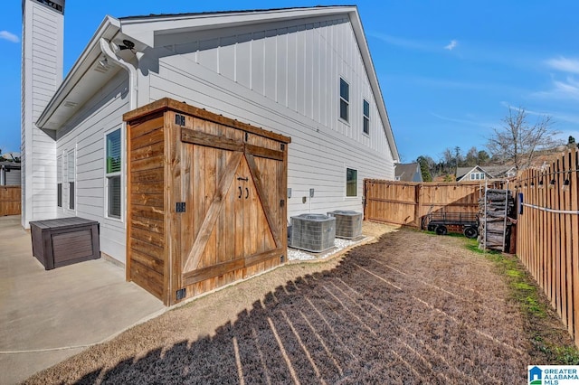 view of side of home featuring cooling unit