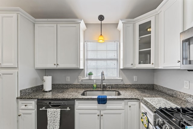 kitchen with white cabinets, pendant lighting, sink, and appliances with stainless steel finishes