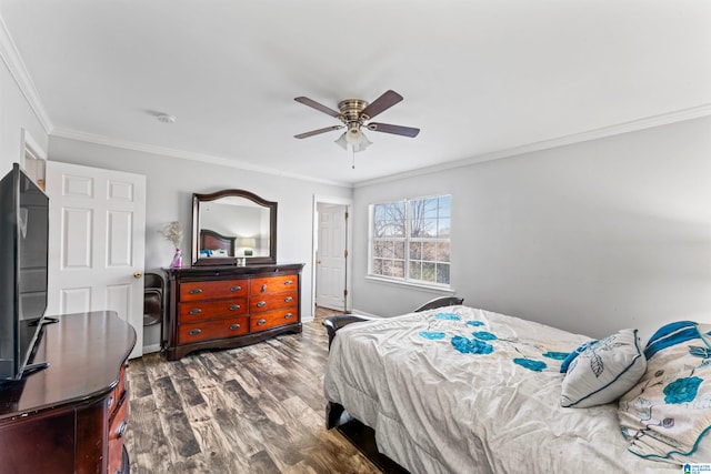 bedroom with ceiling fan, dark wood-type flooring, and ornamental molding