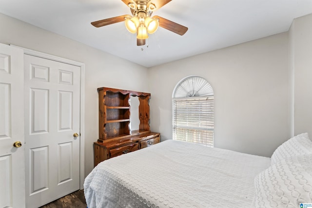 bedroom with ceiling fan and dark hardwood / wood-style flooring