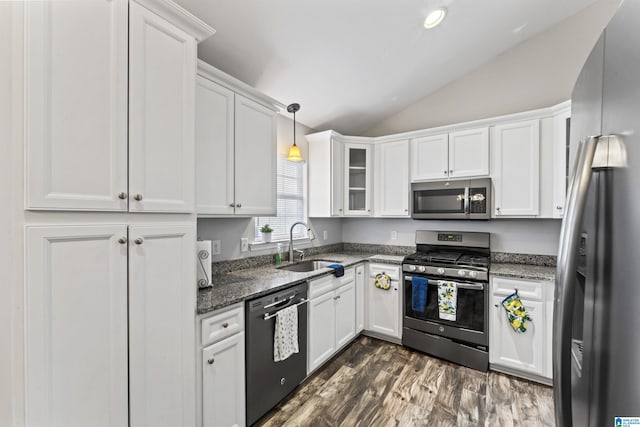 kitchen featuring lofted ceiling, sink, white cabinetry, and stainless steel appliances