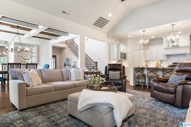 living room featuring beam ceiling and dark hardwood / wood-style flooring