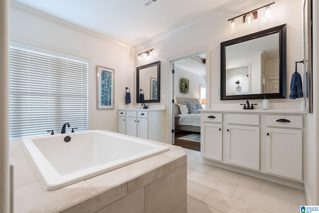 bathroom featuring vanity, tile patterned floors, ornamental molding, and tiled tub