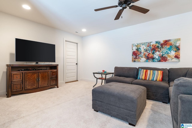 living room featuring light carpet and ceiling fan