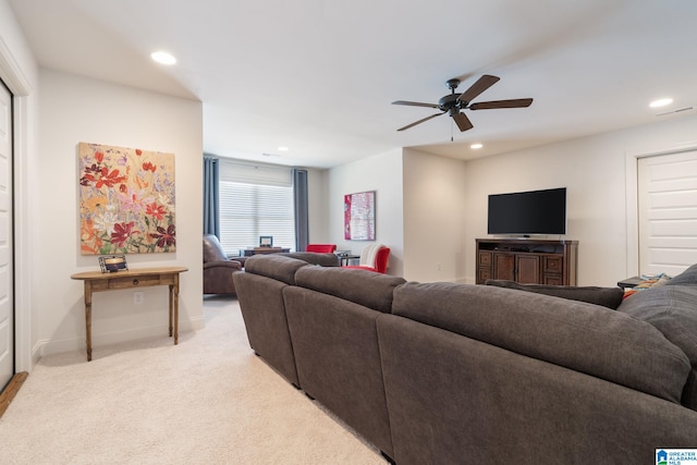 living room featuring light carpet and ceiling fan