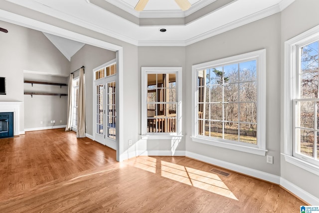 interior space featuring crown molding, hardwood / wood-style floors, and ceiling fan