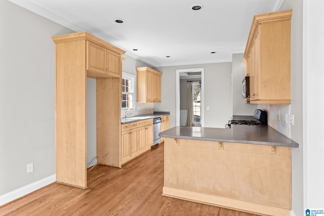 kitchen featuring light brown cabinets, light wood-type flooring, ornamental molding, kitchen peninsula, and stainless steel appliances