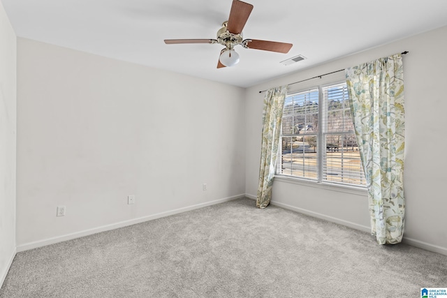 unfurnished room featuring light colored carpet and ceiling fan