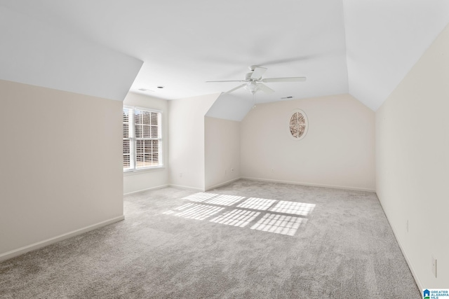 bonus room with ceiling fan, light colored carpet, and lofted ceiling