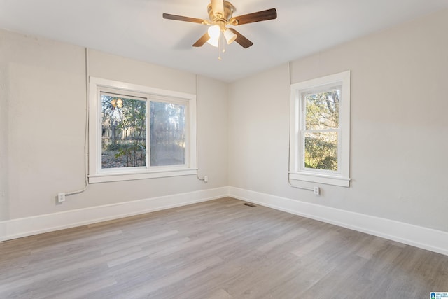 unfurnished room featuring ceiling fan and light wood-type flooring