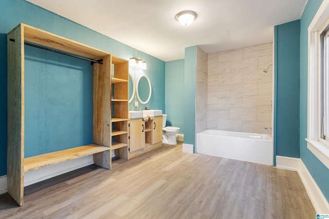 bathroom with vanity, wood-type flooring, and toilet