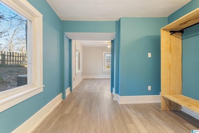 interior space with light wood-type flooring and ceiling fan