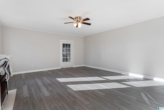 unfurnished living room with dark hardwood / wood-style floors and ceiling fan