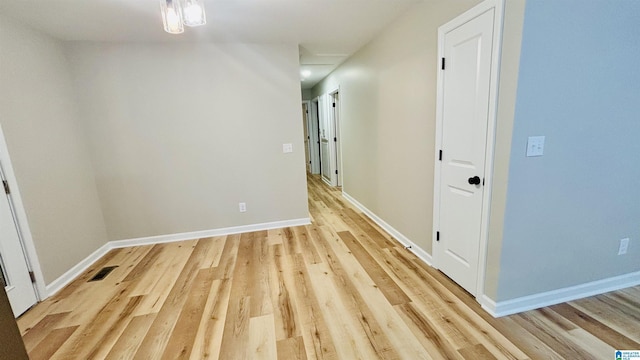 hall with light hardwood / wood-style floors