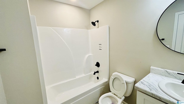 full bathroom featuring vanity,  shower combination, and toilet