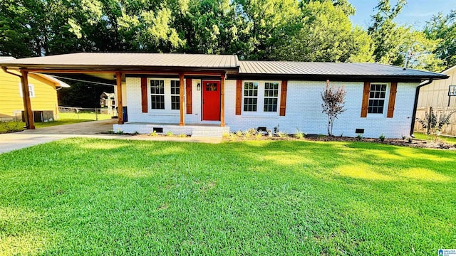 ranch-style house featuring a carport and a front lawn