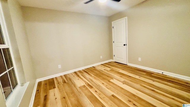 spare room featuring hardwood / wood-style flooring and ceiling fan