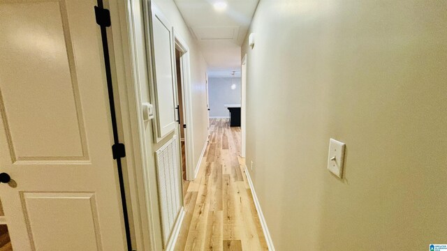 corridor featuring light hardwood / wood-style floors