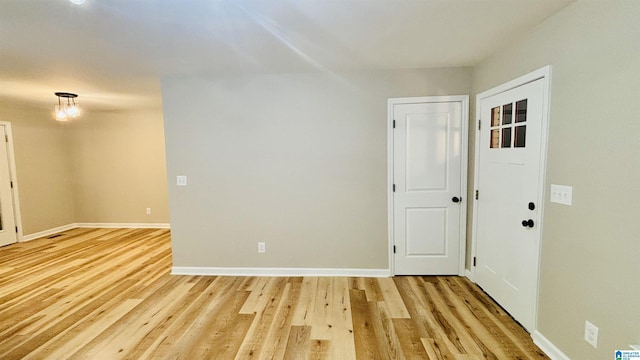 spare room featuring light hardwood / wood-style floors