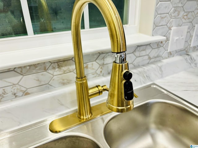 interior details with sink and backsplash