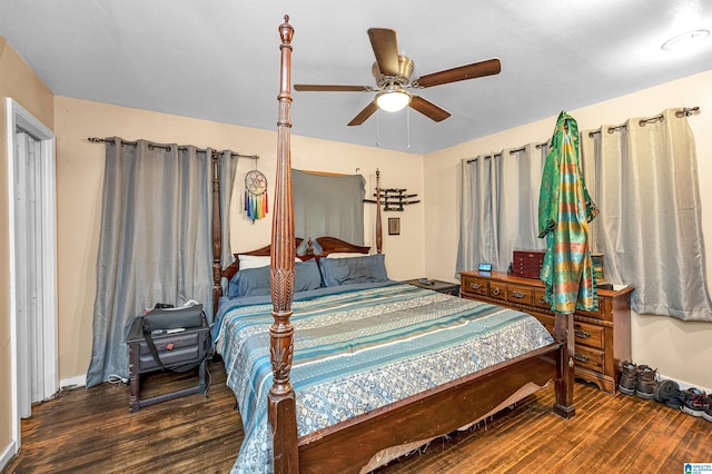 bedroom with ceiling fan and dark hardwood / wood-style flooring