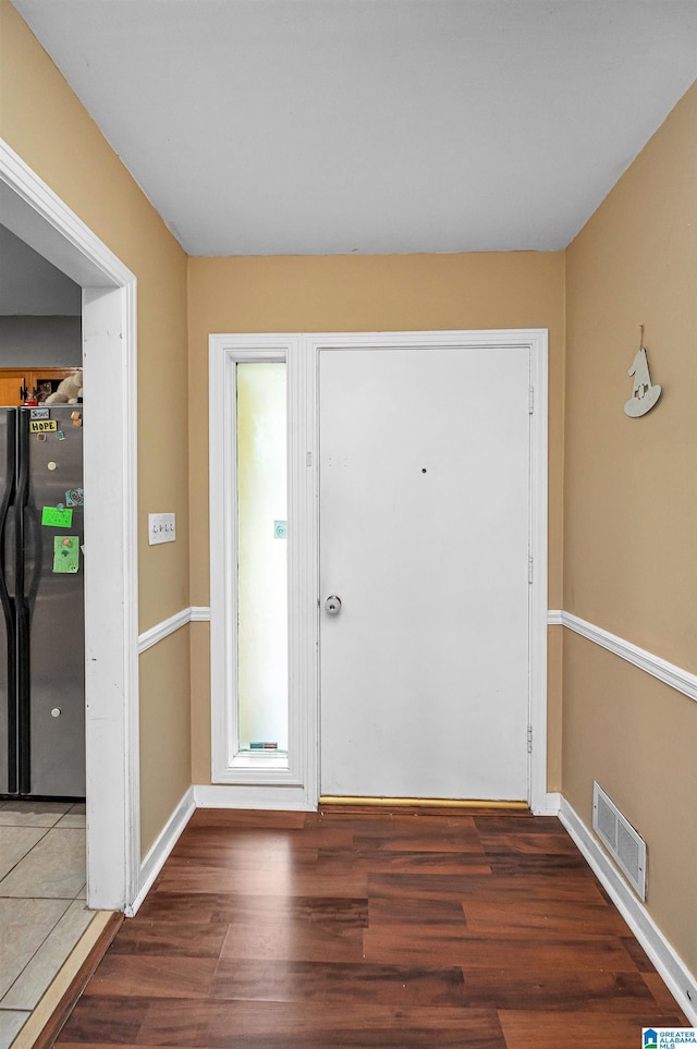 doorway featuring dark wood-type flooring