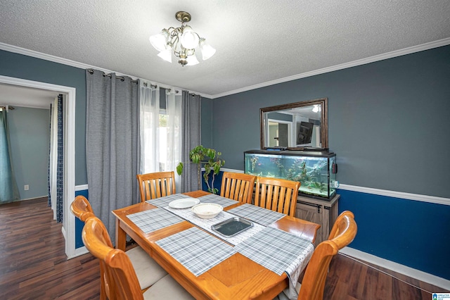 dining room featuring ornamental molding, a textured ceiling, dark hardwood / wood-style floors, and a notable chandelier