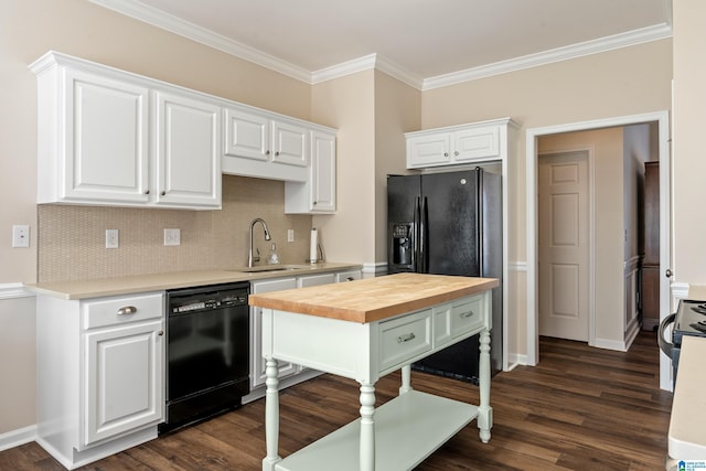 kitchen featuring white cabinets, butcher block countertops, and dishwasher