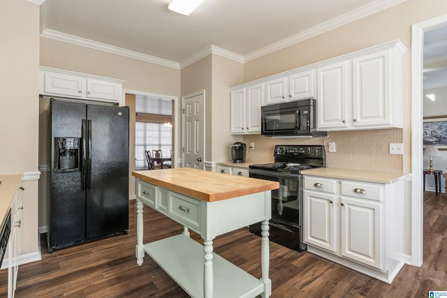 kitchen with butcher block counters, white cabinets, backsplash, black appliances, and crown molding