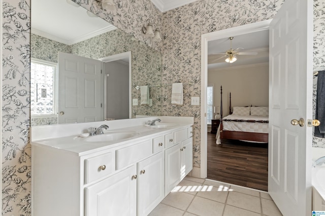 bathroom with ceiling fan, vanity, crown molding, and tile patterned floors