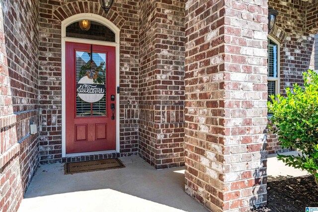 property entrance with brick siding