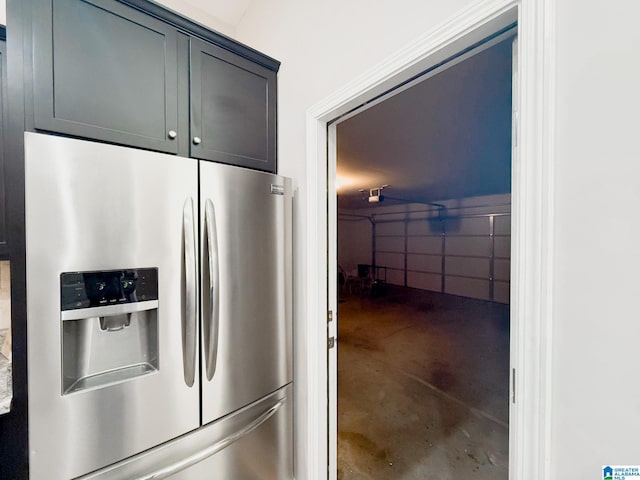 kitchen featuring stainless steel refrigerator with ice dispenser