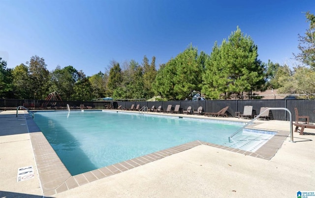 view of pool featuring a patio