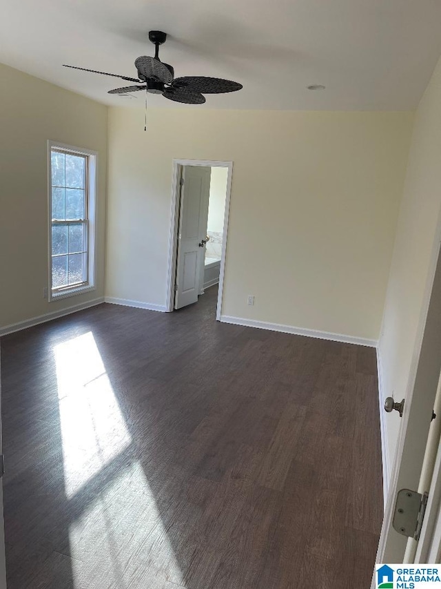 unfurnished room with ceiling fan and dark hardwood / wood-style floors