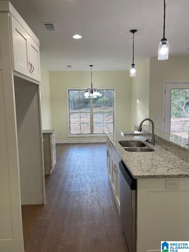 kitchen featuring sink, white cabinets, stainless steel dishwasher, and decorative light fixtures