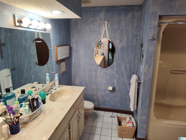 bathroom featuring tile patterned flooring, vanity, and toilet