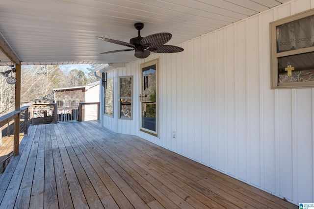 wooden terrace featuring ceiling fan