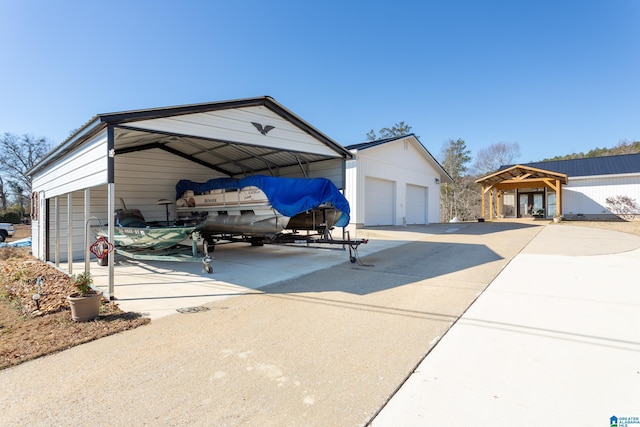 exterior space featuring an outbuilding, a garage, and a carport