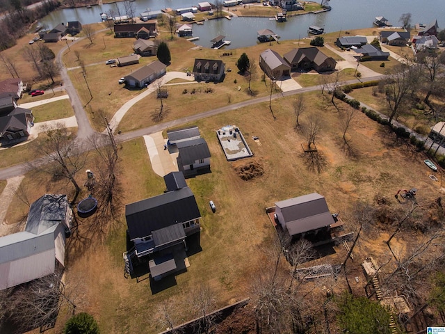 bird's eye view featuring a residential view and a water view