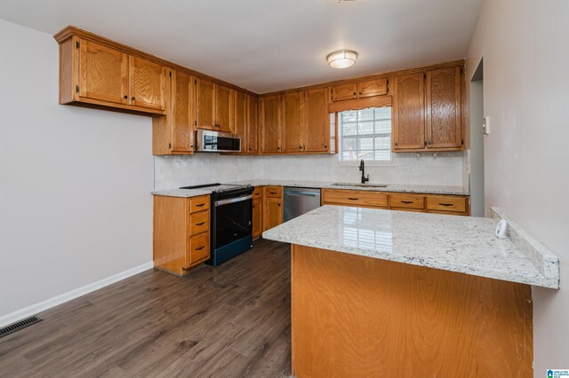 kitchen with decorative backsplash, sink, stainless steel appliances, and dark hardwood / wood-style floors