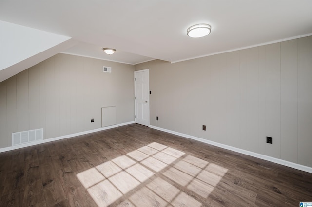 additional living space with dark hardwood / wood-style floors