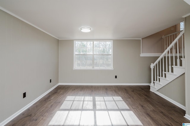 interior space featuring dark hardwood / wood-style floors and ornamental molding