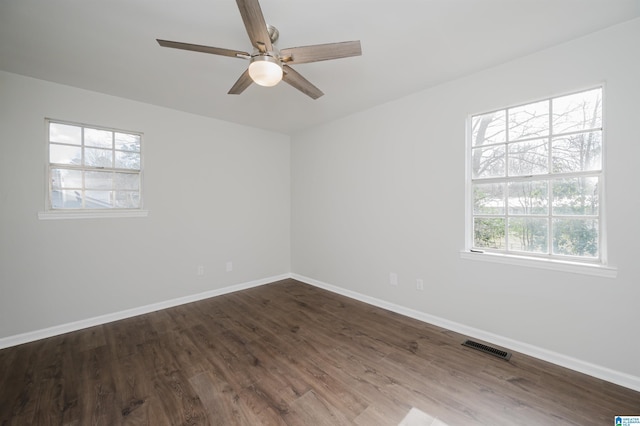 spare room featuring hardwood / wood-style floors and ceiling fan